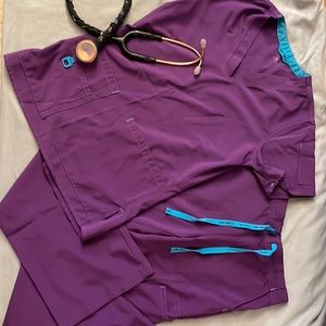 Carhartt Force women’s scrubs. Super cute and stylish! Purple and teal, size XS.